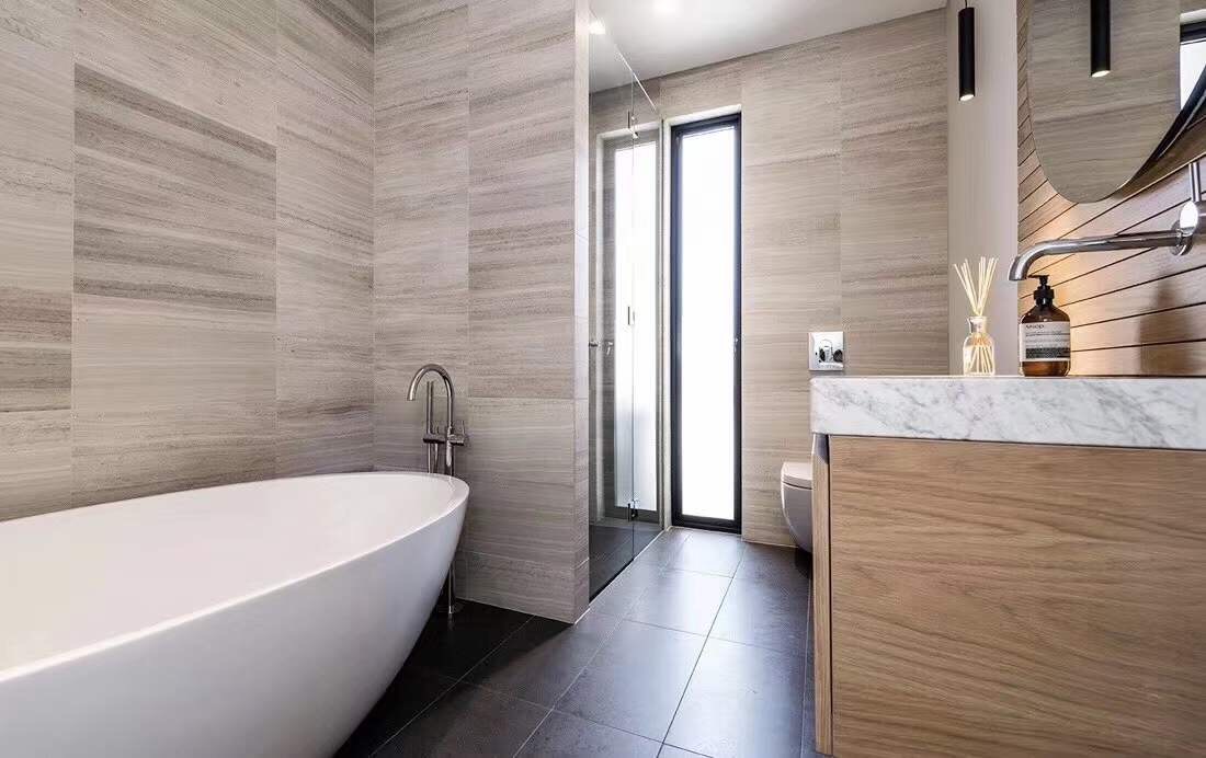 White Wood Marble vein cut wall cladding in luxury hotel bathroom