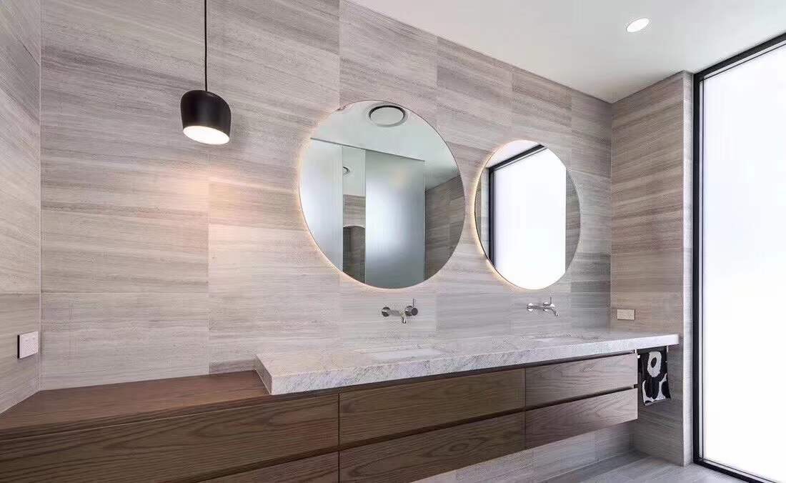 White Wood Marble vein cut panels in luxury residential bathroom